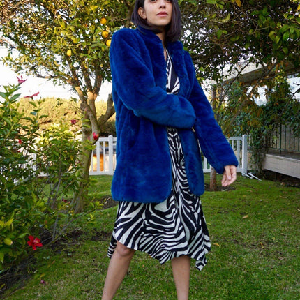 blue faux fur lovestitch coat on a model